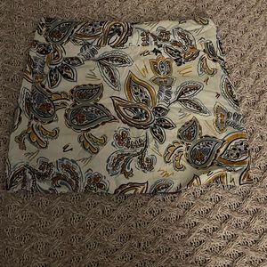 White beach skirt / shorts with multiple colored leaf pattern